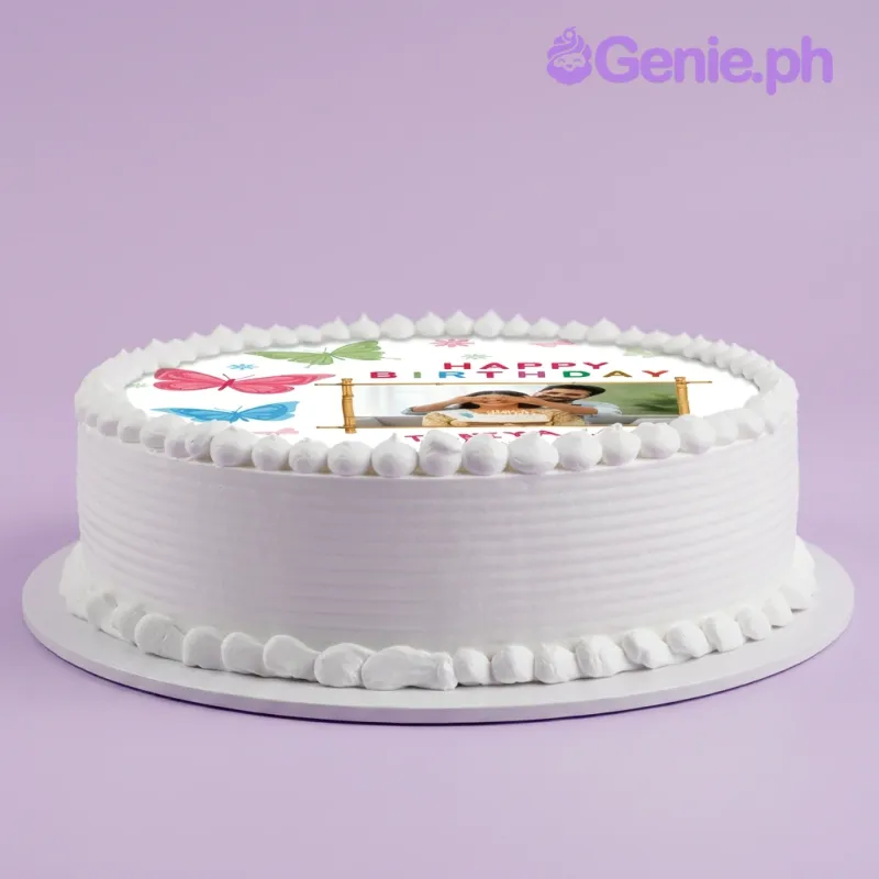 White 1-tier birthday cake with edible photo top and piped icing borders White 1-tier birthday cake with edible photo top and piped icing borders