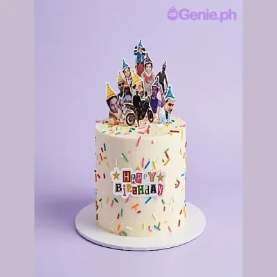 White single-tier birthday cake with colorful sprinkles and multiple photo toppers on top White single-tier birthday cake with colorful sprinkles and multiple photo toppers on top