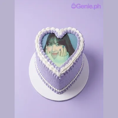 Lavender heart-shaped cake with a photo print on top and a piped border Lavender heart-shaped cake with a photo print on top and a piped border