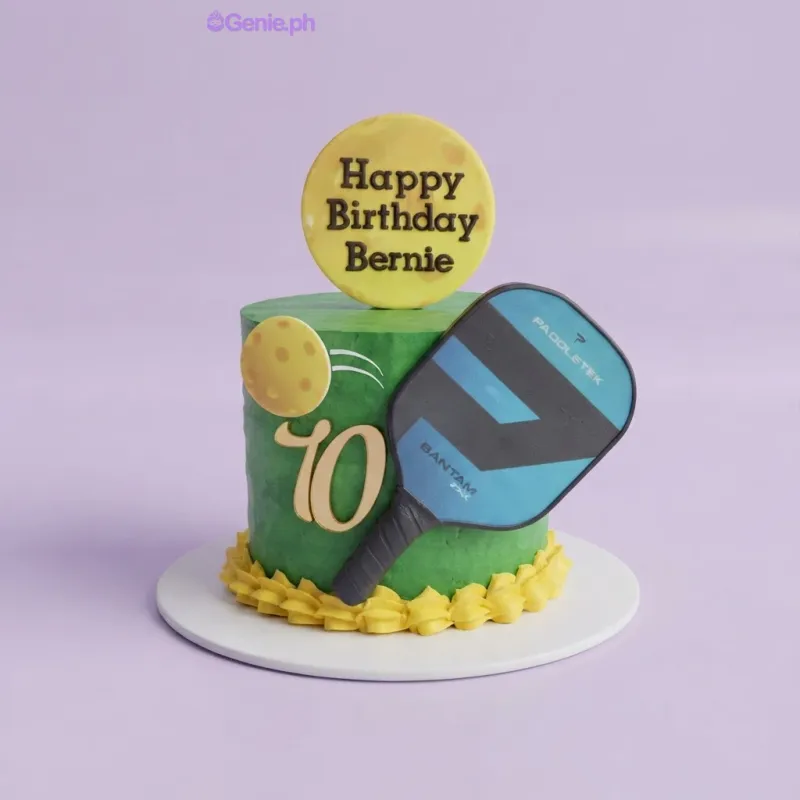 Green 1-tier birthday cake with a pickleball paddle printout, a round birthday message topper, and a gold 70 age topper Green 1-tier birthday cake with a pickleball paddle printout, a round birthday message topper, and a gold 70 age topper