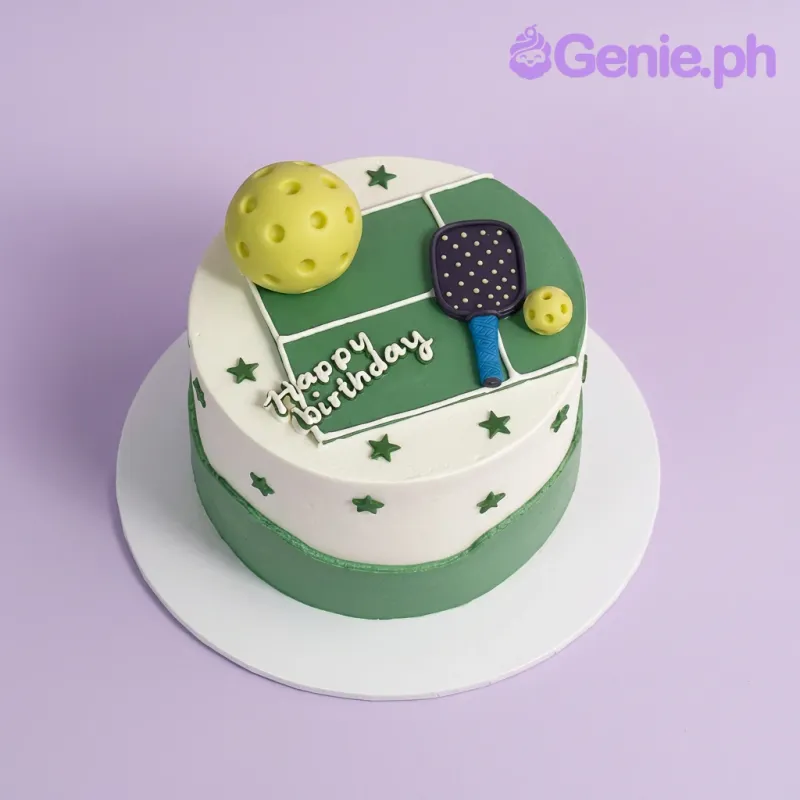 White and green 1-tier cake with a pickleball court design, a fondant paddle, and pickleballs on top White and green 1-tier cake with a pickleball court design, a fondant paddle, and pickleballs on top