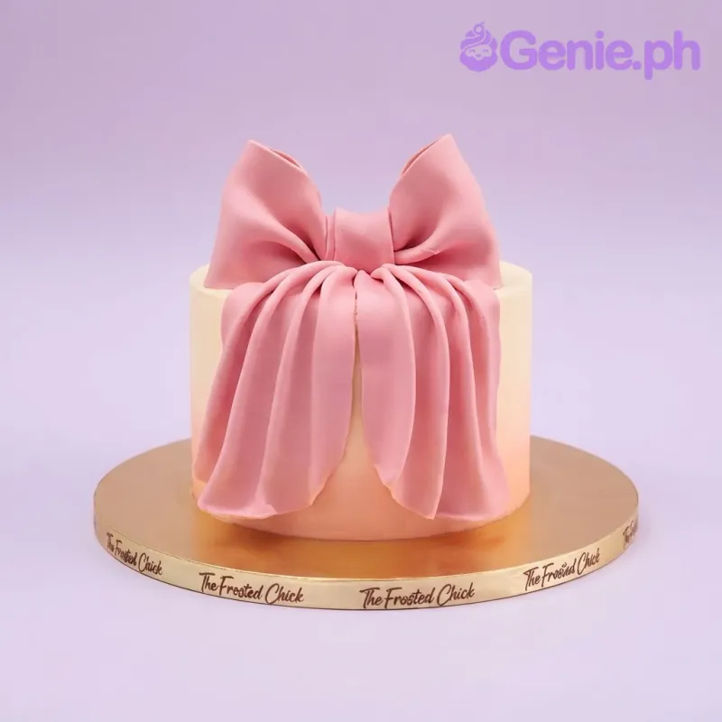 Peach gradient 1-tier cake with a large pink fondant bow topper Peach gradient 1-tier cake with a large pink fondant bow topper