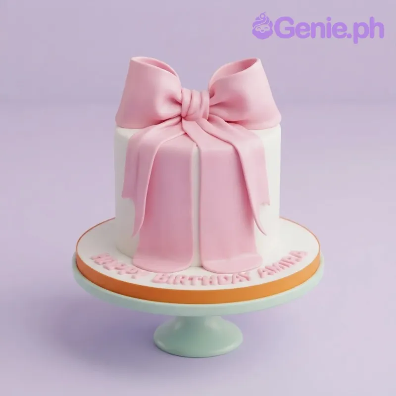 White fondant cake with a large pink fondant bow topper and pink gumpaste letters on the base board White fondant cake with a large pink fondant bow topper and pink gumpaste letters on the base board