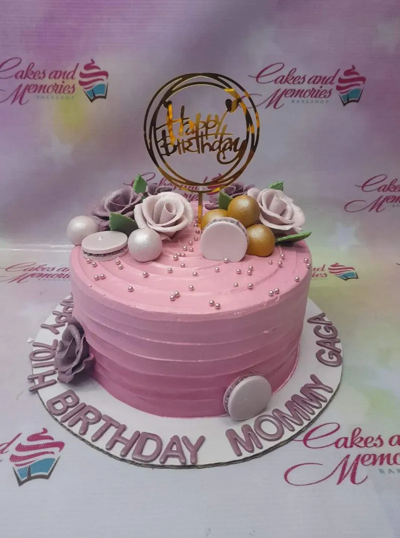 A pink 1-tier cake themed Pink Floral Birthday, featuring a gold Happy Birthday topper and roses. A pink 1-tier cake themed Pink Floral Birthday, featuring a gold Happy Birthday topper and roses.