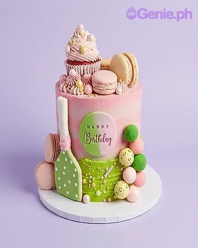 Pink and green 1-tier birthday cake with macarons, a cupcake, and a green spade decoration Pink and green 1-tier birthday cake with macarons, a cupcake, and a green spade decoration