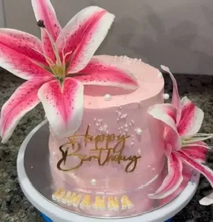 Pink 1 tier cake with smooth soft icing, pink stargazer lily cluster, and gold cardstock birthday topper Pink 1 tier cake with smooth soft icing, pink stargazer lily cluster, and gold cardstock birthday topper