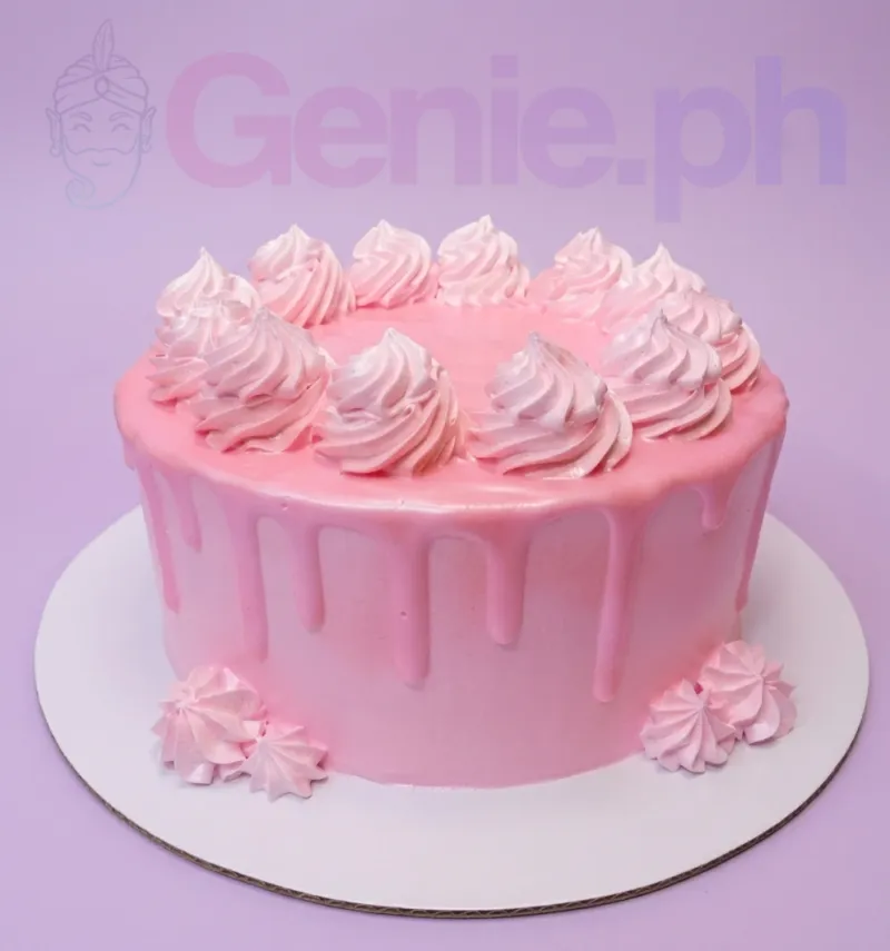 A pink single tier cake themed around Minimalist, featuring large piped icing rosettes on top and base and pink icing drips. A pink single tier cake themed around Minimalist, featuring large piped icing rosettes on top and base and pink icing drips.