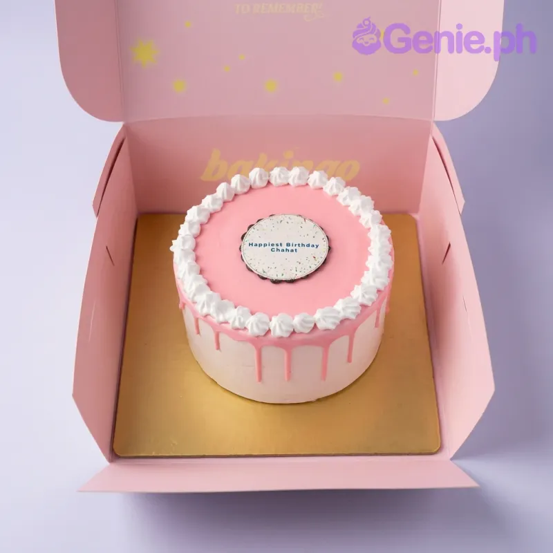A pink and white 1-tier cake themed around Pink Minimalist, featuring a circular birthday message topper and pink drip. A pink and white 1-tier cake themed around Pink Minimalist, featuring a circular birthday message topper and pink drip.