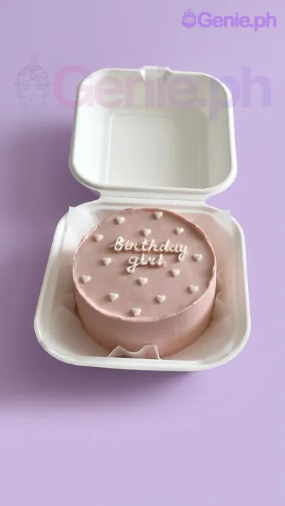 A pink and white Bento cake themed around Pink Minimalist, featuring white icing hearts and a "Birthday girl" message. A pink and white Bento cake themed around Pink Minimalist, featuring white icing hearts and a "Birthday girl" message.