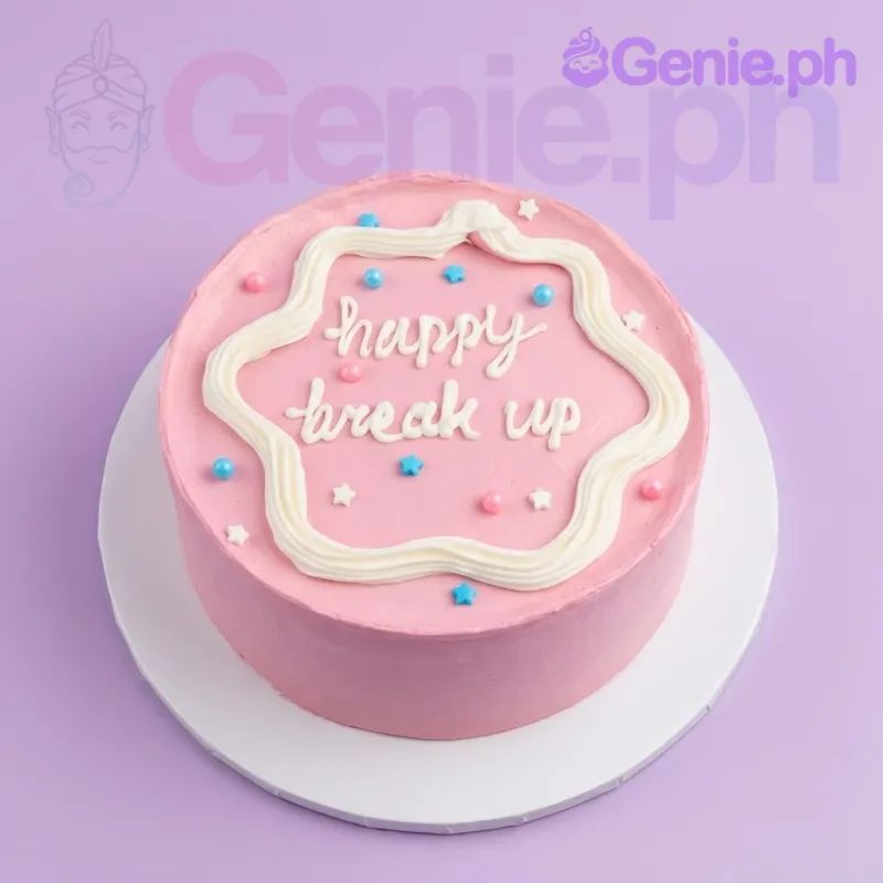 A pink minimalist 1 tier cake with white wavy icing border, 'happy break up' message, and colorful star and pearl sprinkles. A pink minimalist 1 tier cake with white wavy icing border, 'happy break up' message, and colorful star and pearl sprinkles.