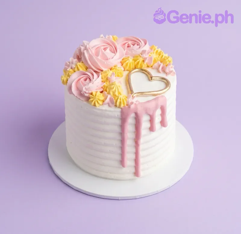 A white and pink 1-tier cake themed around Pink Minimalist, featuring a gold heart topper, pink rosettes, yellow dollops, and a pink drip. A white and pink 1-tier cake themed around Pink Minimalist, featuring a gold heart topper, pink rosettes, yellow dollops, and a pink drip.