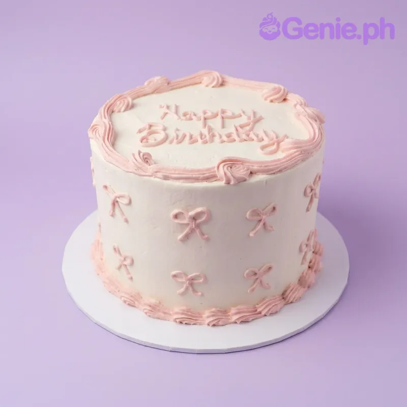 A white and pink 1 Tier cake themed around Minimalism, featuring a 'Happy Birthday' message, pink piped borders, and icing bows. A white and pink 1 Tier cake themed around Minimalism, featuring a 'Happy Birthday' message, pink piped borders, and icing bows.
