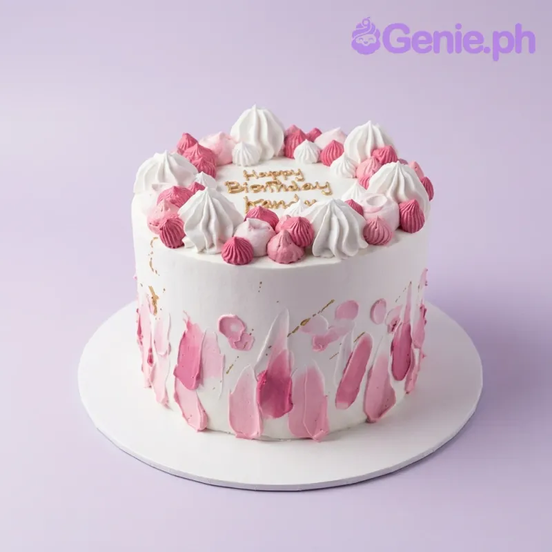 A white and pink 1-tier cake with pink palette knife icing, gold 'Happy Birthday' text, and meringue kisses. A white and pink 1-tier cake with pink palette knife icing, gold 'Happy Birthday' text, and meringue kisses.