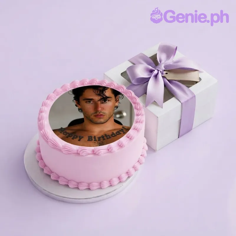 Pink single tier cake with smooth soft icing, an edible photo portrait, and piped shell borders Pink single tier cake with smooth soft icing, an edible photo portrait, and piped shell borders