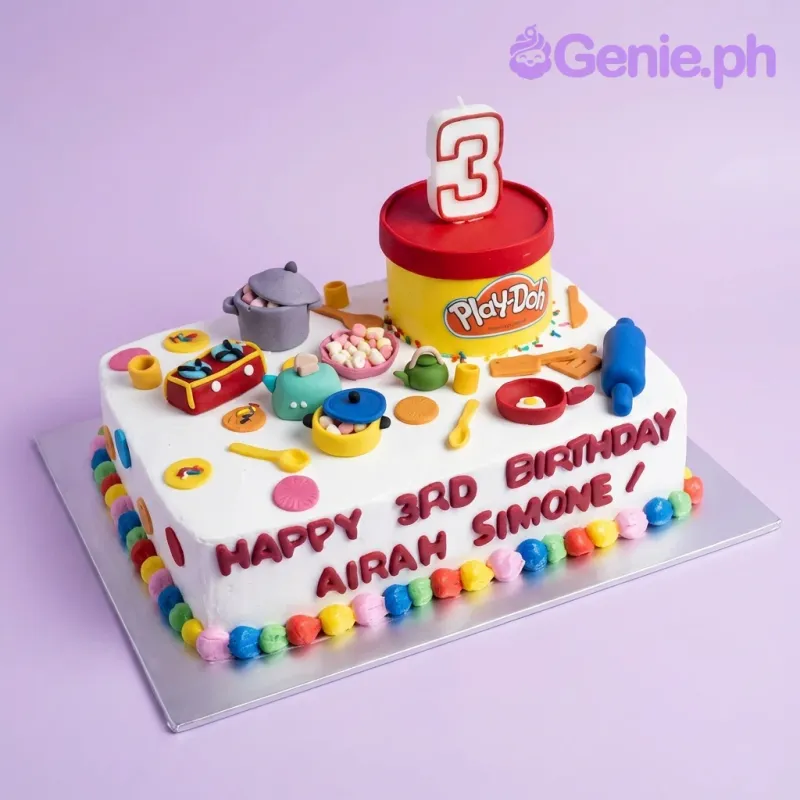 Rectangle Play-Doh themed birthday cake with colorful fondant kitchen tools and a large yellow Play-Doh tub topper. Rectangle Play-Doh themed birthday cake with colorful fondant kitchen tools and a large yellow Play-Doh tub topper.