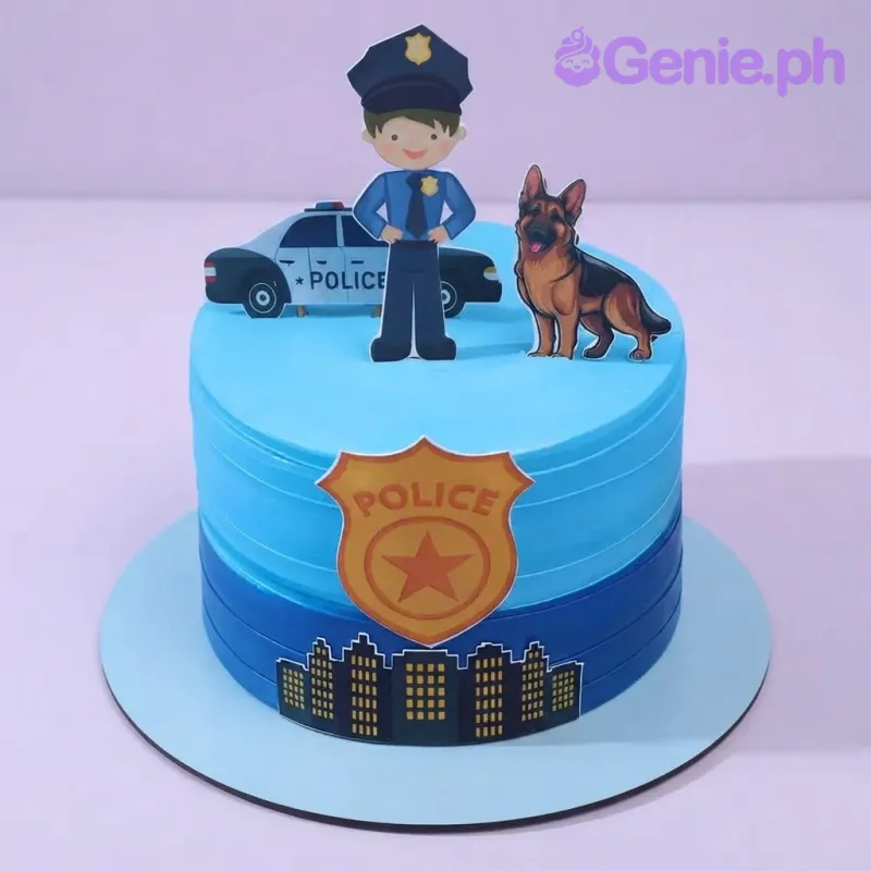 Light blue and dark blue single tier cake with smooth soft icing, police officer printout, car, and dog Light blue and dark blue single tier cake with smooth soft icing, police officer printout, car, and dog