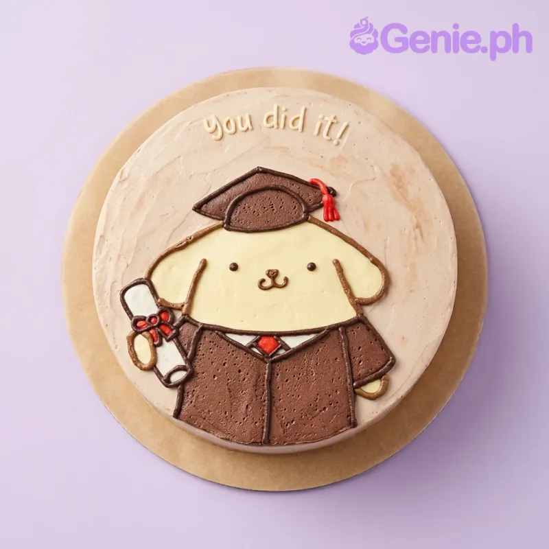 A beige round 1-tier cake themed around Pompompurin Graduation, featuring a Pompompurin character in cap and gown with a diploma, and 'you did it!' text. A beige round 1-tier cake themed around Pompompurin Graduation, featuring a Pompompurin character in cap and gown with a diploma, and 'you did it!' text.