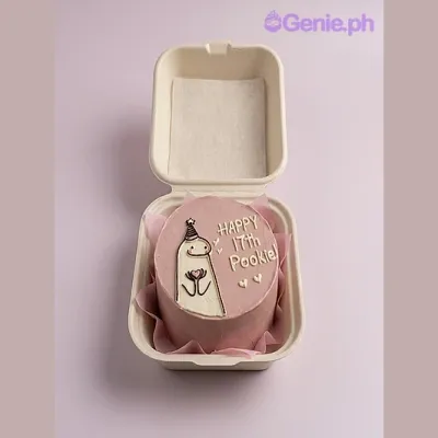 Pink bento cake with a Flork character holding a heart, piped hearts, and a piped message Pink bento cake with a Flork character holding a heart, piped hearts, and a piped message