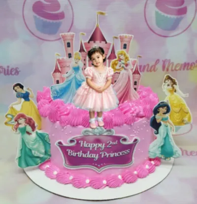 Hot pink 1-tier cake with piped rosettes, Disney princess character printouts, a castle topper, and a photo of a child Hot pink 1-tier cake with piped rosettes, Disney princess character printouts, a castle topper, and a photo of a child