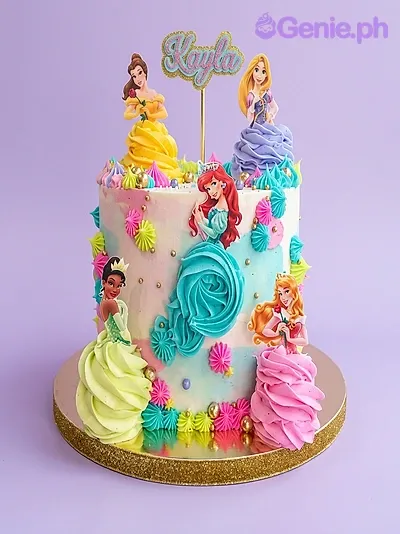 Multicolor 1-tier birthday cake with Disney princess printout toppers and piped icing rosettes Multicolor 1-tier birthday cake with Disney princess printout toppers and piped icing rosettes