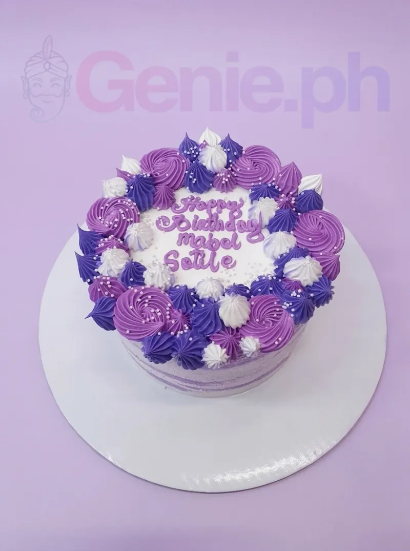 A purple and white 1-tier cake themed around Purple Floral, featuring icing rosettes and white pearl sprinkles. A purple and white 1-tier cake themed around Purple Floral, featuring icing rosettes and white pearl sprinkles.