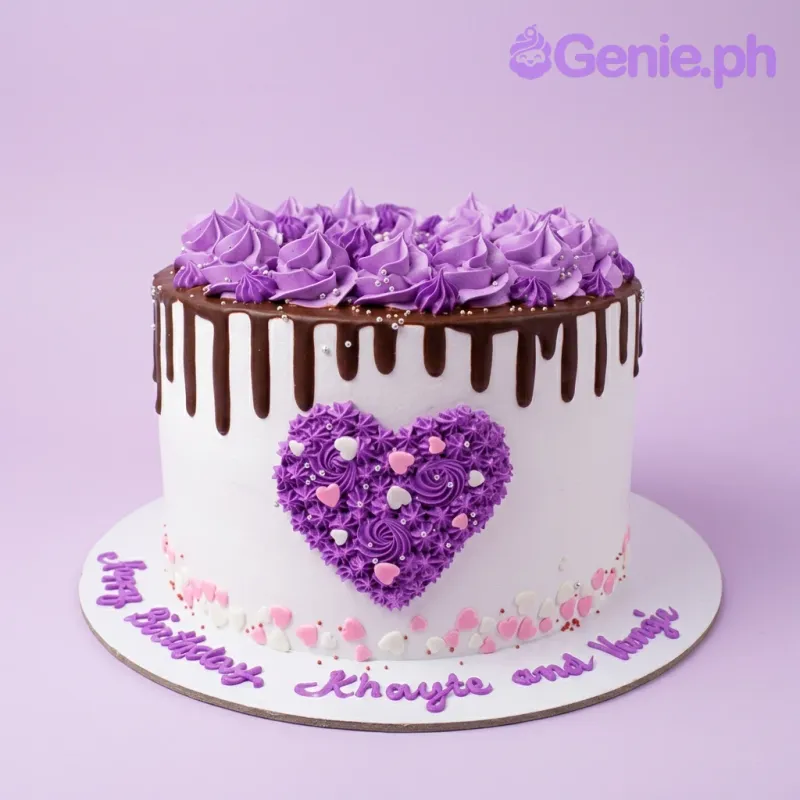 A white, purple, and chocolate 1-tier cake themed Purple Heart, with purple rosettes, chocolate drip, and a piped heart design. A white, purple, and chocolate 1-tier cake themed Purple Heart, with purple rosettes, chocolate drip, and a piped heart design.