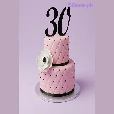 Pink 2-tier quilted fondant cake with a large white flower and black number 30 topper Pink 2-tier quilted fondant cake with a large white flower and black number 30 topper