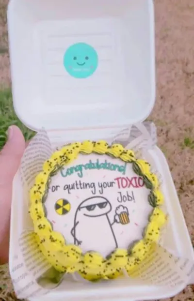 White and yellow bento cake with smooth icing, a quitting job theme, an edible character printout, and a yellow piped swirl border White and yellow bento cake with smooth icing, a quitting job theme, an edible character printout, and a yellow piped swirl border