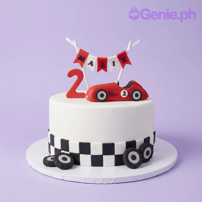 White 1-tier fondant cake with a red race car topper and a checkered flag border White 1-tier fondant cake with a red race car topper and a checkered flag border