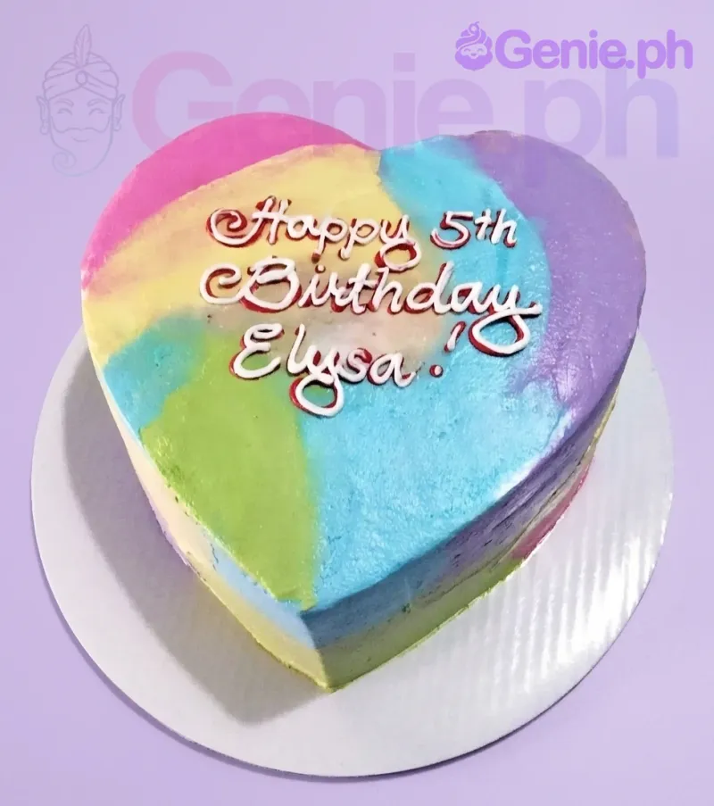 A multicolor 1 Tier heart-shaped cake themed around Rainbow Heart, featuring vibrant watercolor icing and a white piped message 'Happy 5th Birthday Elysa!'. A multicolor 1 Tier heart-shaped cake themed around Rainbow Heart, featuring vibrant watercolor icing and a white piped message 'Happy 5th Birthday Elysa!'.