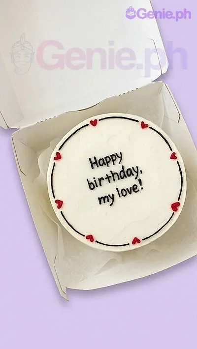 A white, black, and red Bento cake themed Red Minimalist, featuring black piped icing text and small red heart decorations. A white, black, and red Bento cake themed Red Minimalist, featuring black piped icing text and small red heart decorations.