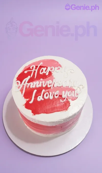 A white, red, and pink 1-tier cake themed minimalist anniversary, featuring palette knife strokes and a piped message. A white, red, and pink 1-tier cake themed minimalist anniversary, featuring palette knife strokes and a piped message.