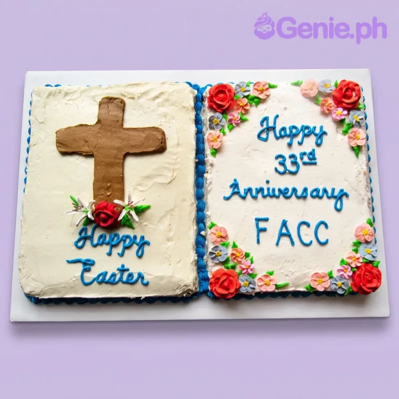 A white rectangular open-book cake themed for a Religious Anniversary and Easter, featuring a large brown cross, white lilies, and blue piped messages. A white rectangular open-book cake themed for a Religious Anniversary and Easter, featuring a large brown cross, white lilies, and blue piped messages.