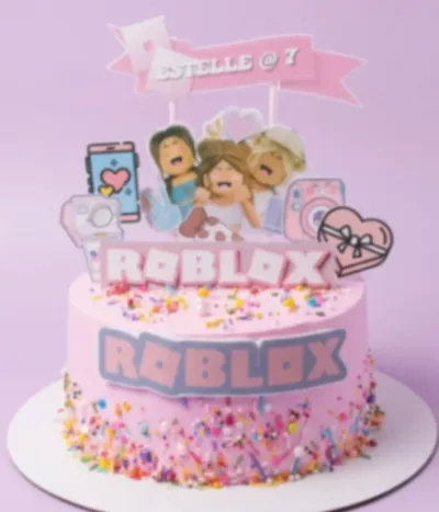 Pastel pink 1-tier cake with soft icing, Roblox character cutouts, and multicolor sprinkles Pastel pink 1-tier cake with soft icing, Roblox character cutouts, and multicolor sprinkles