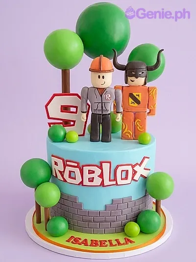 A blue Roblox themed 1 Tier Fondant cake, featuring fondant character figures, green trees, a number 9, and brick wall paneling. A blue Roblox themed 1 Tier Fondant cake, featuring fondant character figures, green trees, a number 9, and brick wall paneling.