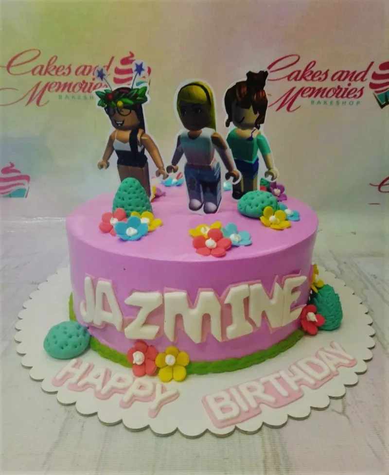 A pink and green 1-Tier cake themed around Roblox, featuring Roblox girl character printouts and flowers with bushes. A pink and green 1-Tier cake themed around Roblox, featuring Roblox girl character printouts and flowers with bushes.