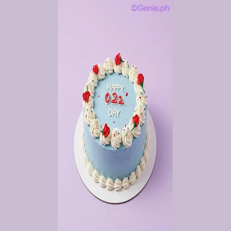 Light blue 1-tier cake with red edible roses and white piped rosettes Light blue 1-tier cake with red edible roses and white piped rosettes