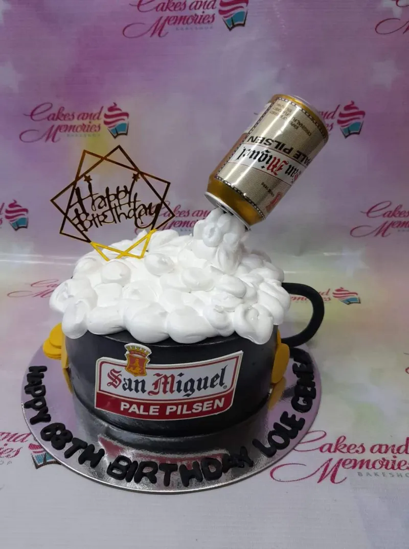 A black and white 1-tier cake themed around San Miguel Beer, featuring a beer can, Happy Birthday topper, and white icing foam. A black and white 1-tier cake themed around San Miguel Beer, featuring a beer can, Happy Birthday topper, and white icing foam.