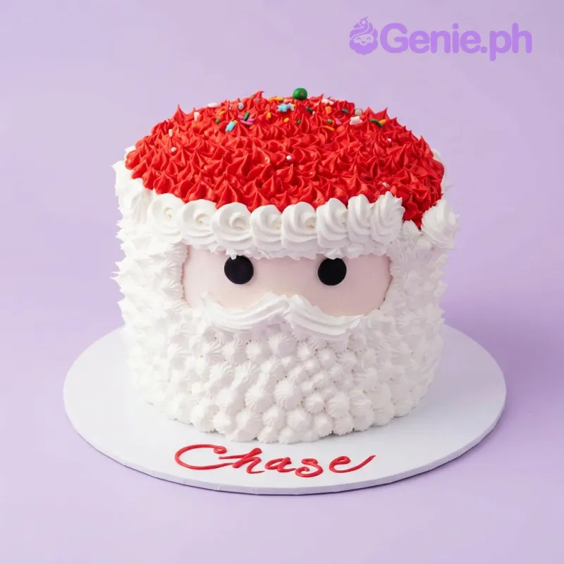 A red and white 1 Tier cake themed around Santa Claus, featuring a red icing hat, white icing beard, black eyes, and multicolored sprinkles. A red and white 1 Tier cake themed around Santa Claus, featuring a red icing hat, white icing beard, black eyes, and multicolored sprinkles.