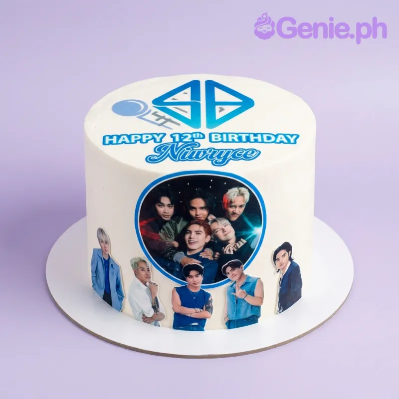 White 1-tier birthday cake with SB19 band photo printouts and blue birthday message White 1-tier birthday cake with SB19 band photo printouts and blue birthday message