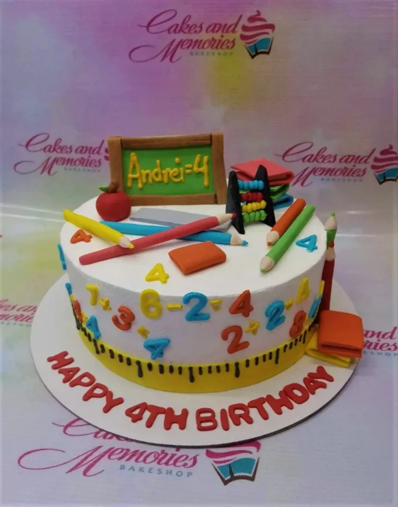 A white 1-tier cake themed around School, featuring a chalkboard, abacus, red apple, fondant pencils, stacked books, and colorful numbers. A white 1-tier cake themed around School, featuring a chalkboard, abacus, red apple, fondant pencils, stacked books, and colorful numbers.