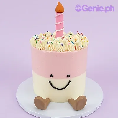 Pink and white single-tier cake with a pink candle topper and a smiley face design Pink and white single-tier cake with a pink candle topper and a smiley face design