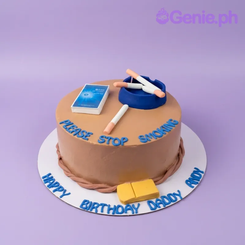 Brown round cake with fondant cigarette pack, ashtray, and cigarettes, featuring a 'Please Stop Smoking' message. Brown round cake with fondant cigarette pack, ashtray, and cigarettes, featuring a 'Please Stop Smoking' message.