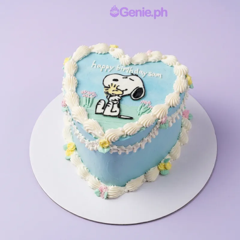 Snoopy Birthday cake design — 1 layer soft icing cake in light blue — with printout of Snoopy and Woodstock, piped white icing border, small piped yellow and pink flowers, white pearl sprinkles, and custom "happy birthday sam" message Snoopy Birthday cake design — 1 layer soft icing cake in light blue — with printout of Snoopy and Woodstock, piped white icing border, small piped yellow and pink flowers, white pearl sprinkles, and custom "happy birthday sam" message