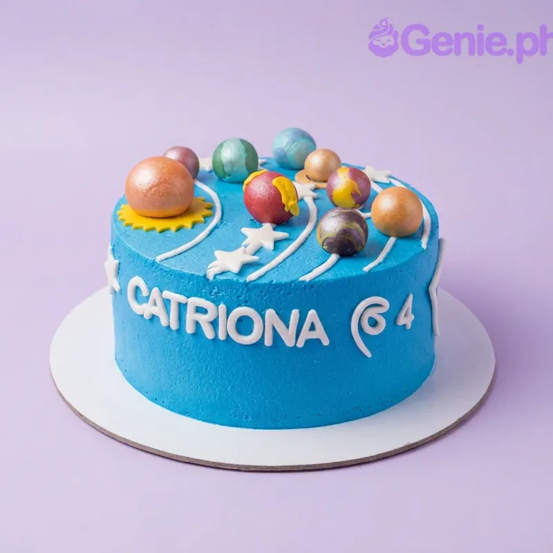 A blue 1-tier cake themed around the Solar System, featuring a 3D fondant sun, planets, white stars, and side text. A blue 1-tier cake themed around the Solar System, featuring a 3D fondant sun, planets, white stars, and side text.