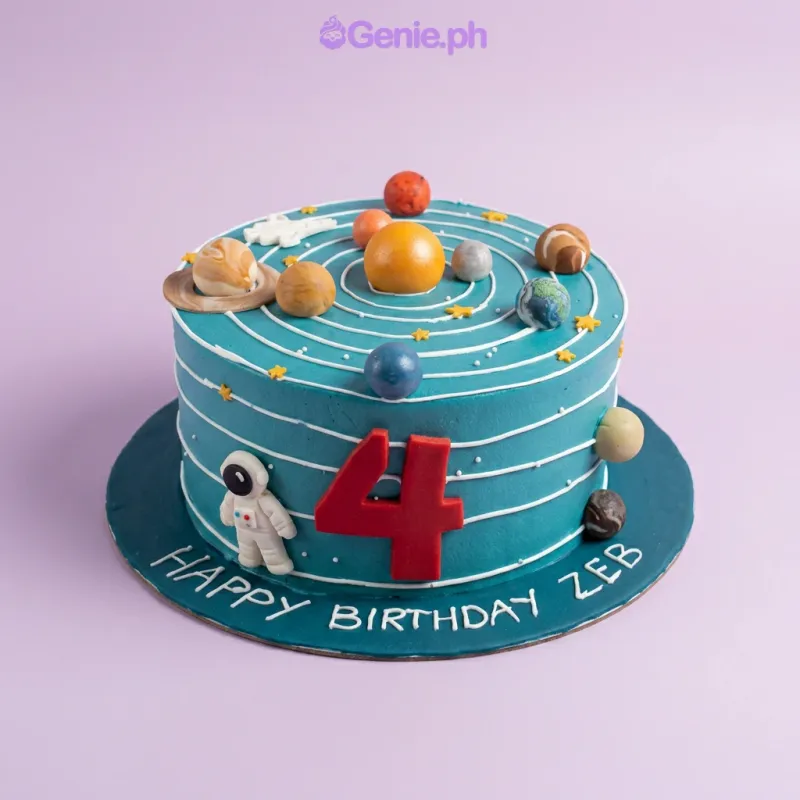 A teal 1-tier Solar System cake, featuring a sun, red number four, planets, and orbital rings. A teal 1-tier Solar System cake, featuring a sun, red number four, planets, and orbital rings.