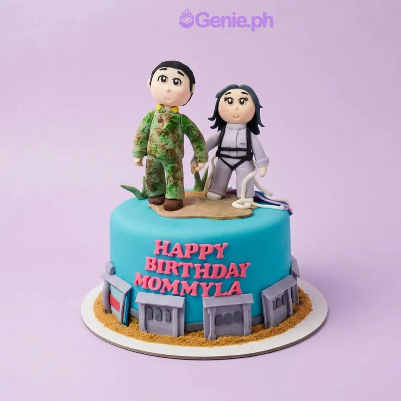 A light blue 1 Tier Fondant cake themed Soldier Birthday, featuring a soldier and a woman, with grey building panels and brown sand accents. A light blue 1 Tier Fondant cake themed Soldier Birthday, featuring a soldier and a woman, with grey building panels and brown sand accents.