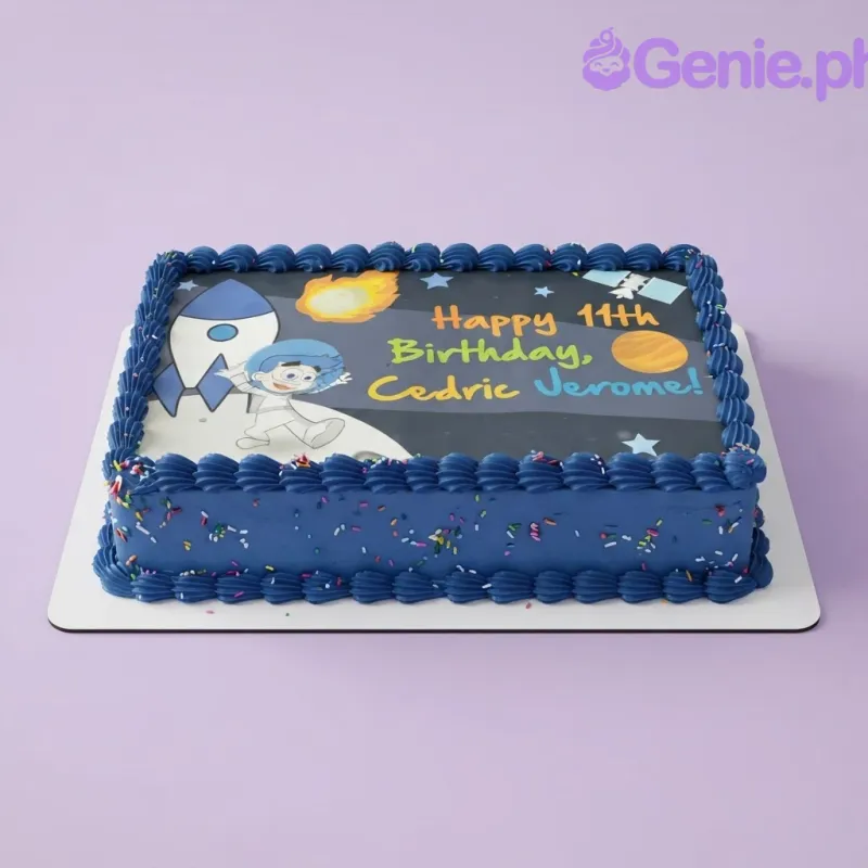 A blue rectangular Space Astronaut cake, featuring an edible photo print of an astronaut and rocket ship, and blue icing rosettes. A blue rectangular Space Astronaut cake, featuring an edible photo print of an astronaut and rocket ship, and blue icing rosettes.