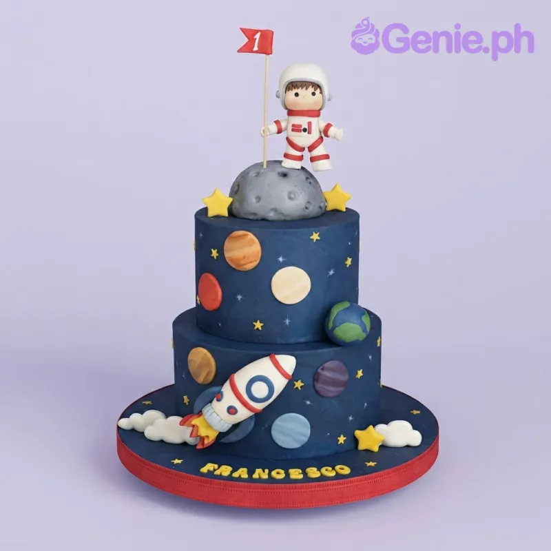 Deep navy blue 2-tier cake with soft icing, space birthday theme, astronaut figurine, and moon sphere Deep navy blue 2-tier cake with soft icing, space birthday theme, astronaut figurine, and moon sphere