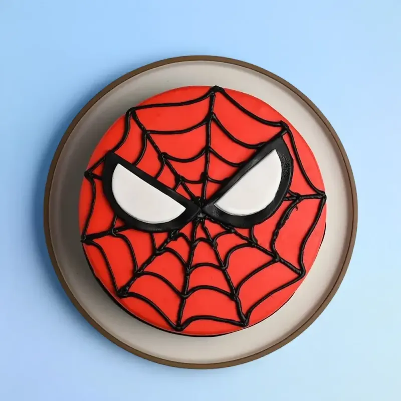 Red 1 tier birthday cake with smooth soft icing, black piped spider web design, and white spider eyes Red 1 tier birthday cake with smooth soft icing, black piped spider web design, and white spider eyes